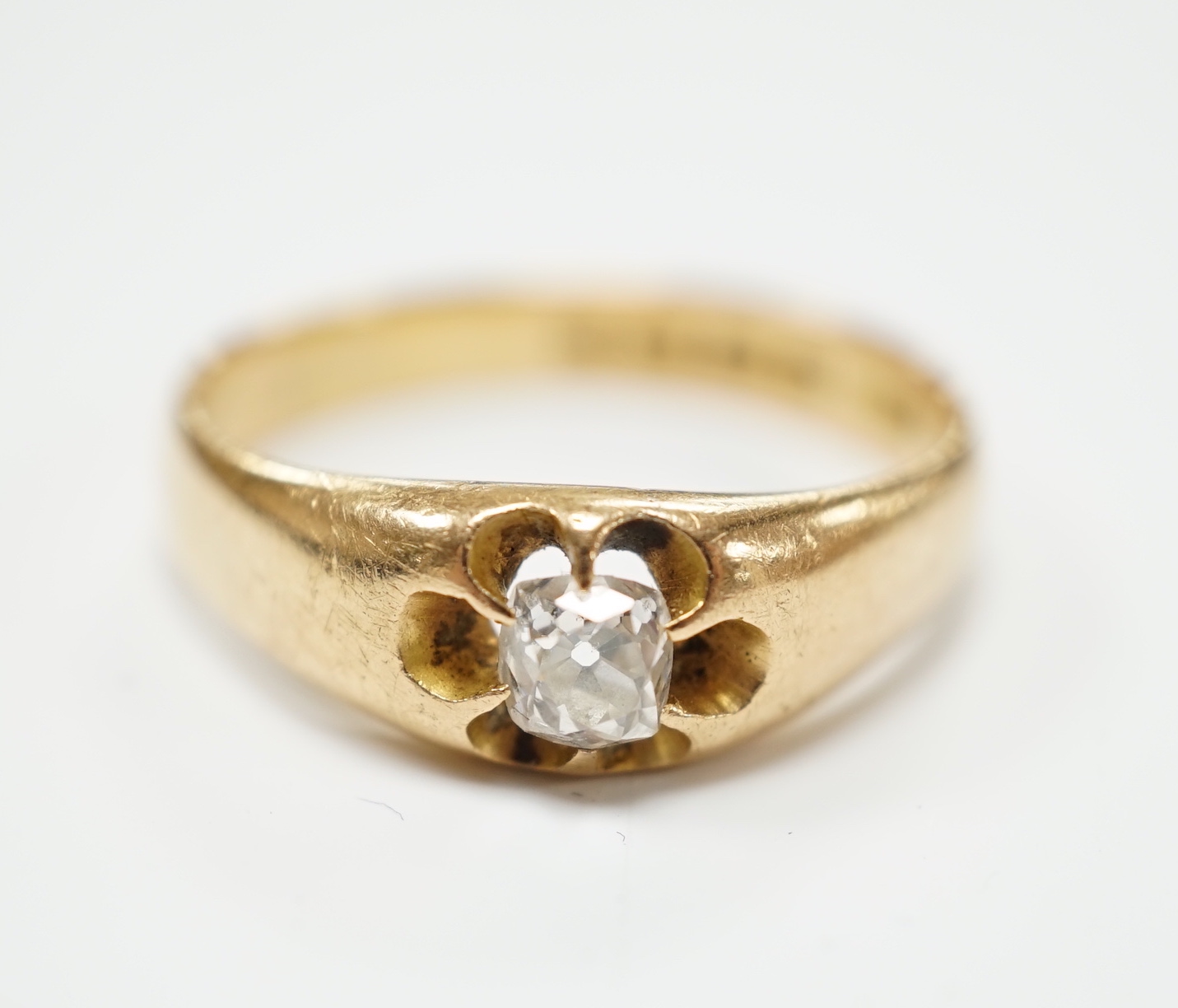 A George V 18ct gold and claw set solitaire diamond ring, size W, gross weight 7.2 grams.